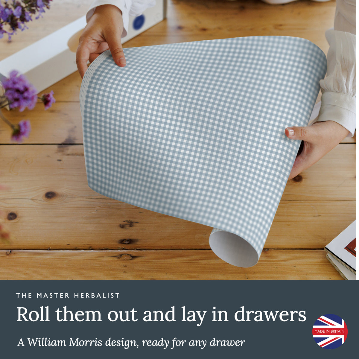 Roll out Cook's Blue Gingham wipe clean drawer liners and lay them in drawers