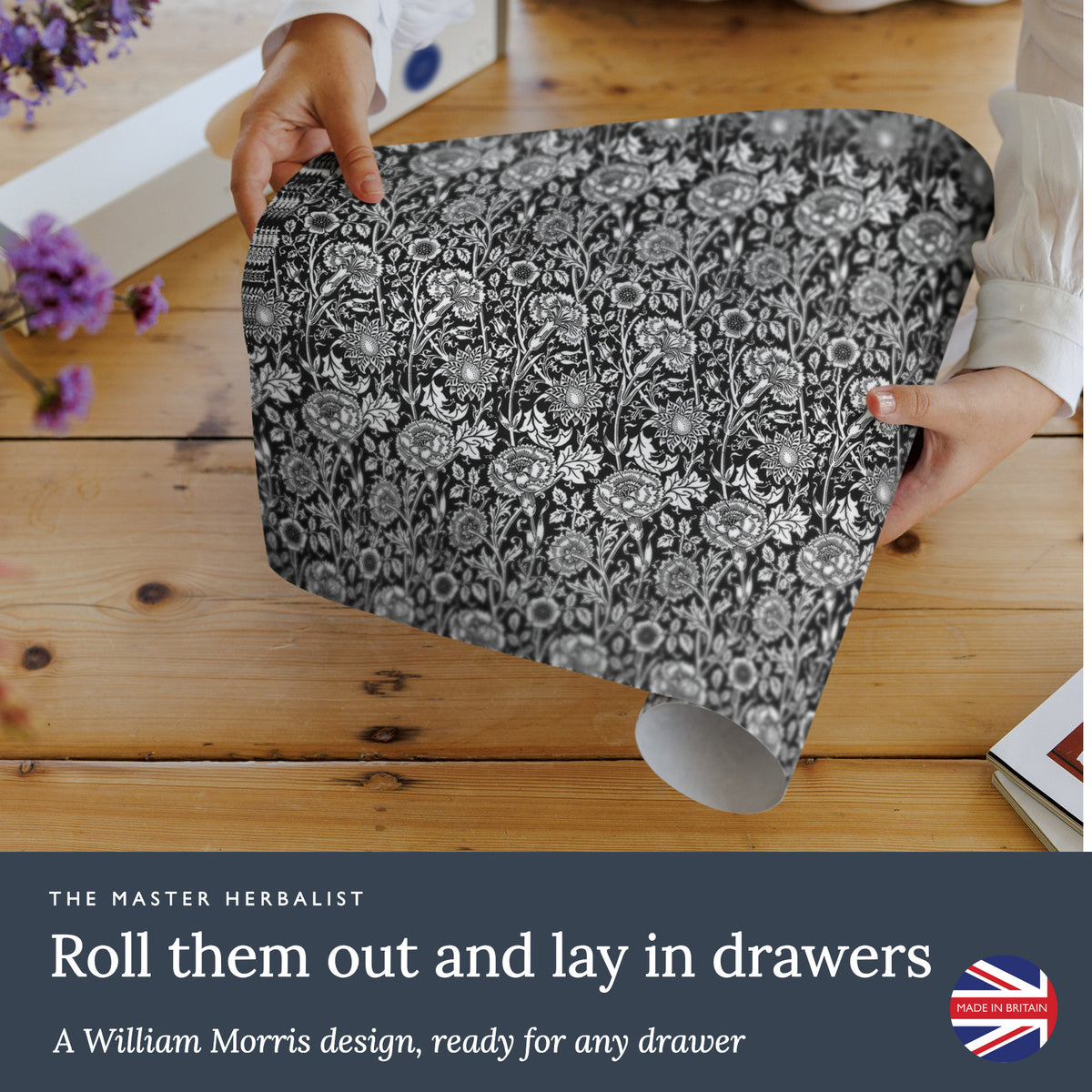Roll out Black William Morris Pinks + Roses wipe clean drawer liners and lay them in drawers