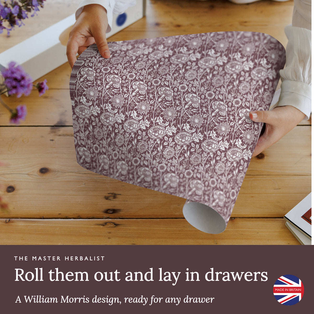 Roll out Damson William Morris Pinks + Roses wipe clean drawer liners and lay them in drawers